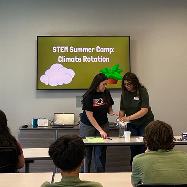 Students at STEM summer camp listen to presentation