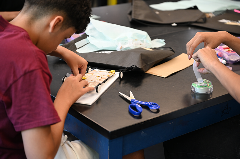 Student building solar car